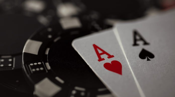olxtoto vip Casino Hold'em live table showing dealer, community cards, player hand, and betting interface on mobile screen